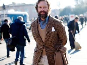 jean shirt with sand coloured v-neck sweaters and brown check jacket