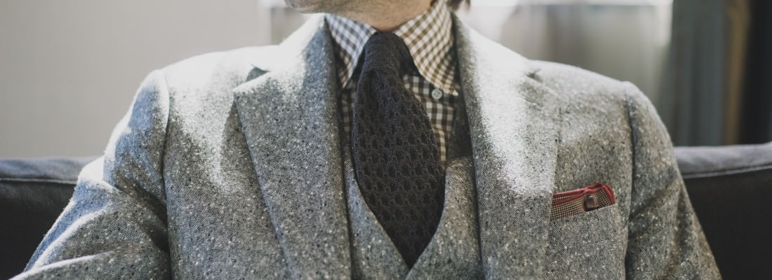 man in tweed suit
