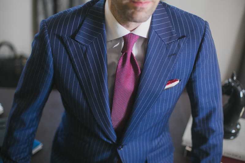 custom tailored pinstripe suit by garrison bespoke closeup with clear view of tie and pocket square
